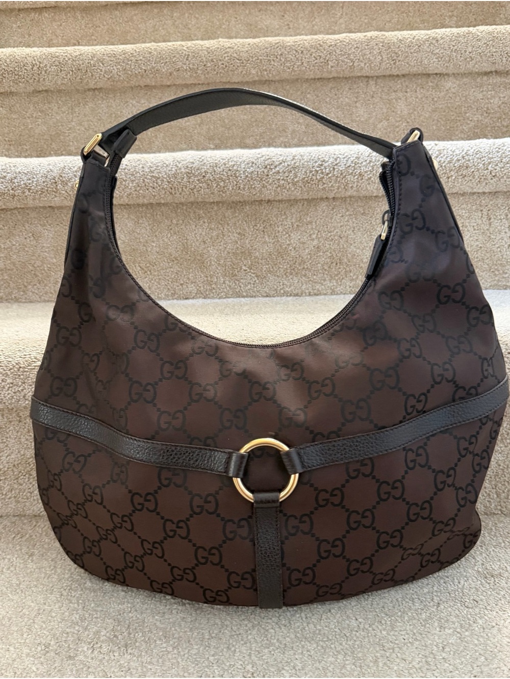 Authentic Gucci Brown Monogram Shoulder Bag with Gold Ring Detail.